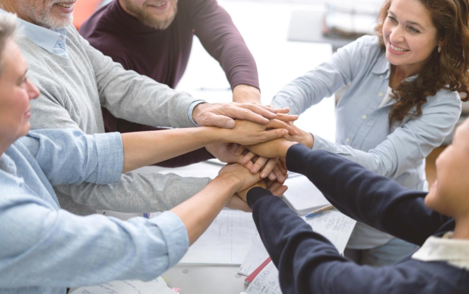 Group of diverse people collaborating on financial planning